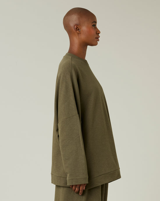 model wears olive jersey taylor top