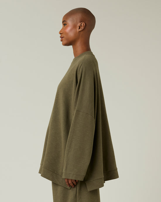 model wears olive jersey taylor top