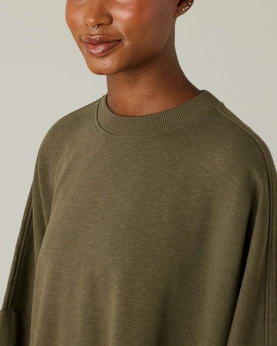 model wears olive jersey taylor top