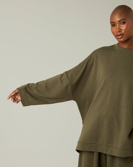 model wears olive jersey taylor top