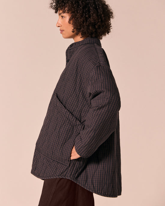 model wears rue dark mulberry gingham quilted denim jacket