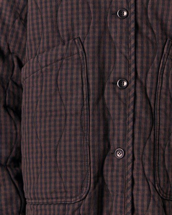 model wears rue dark mulberry gingham quilted denim jacket
