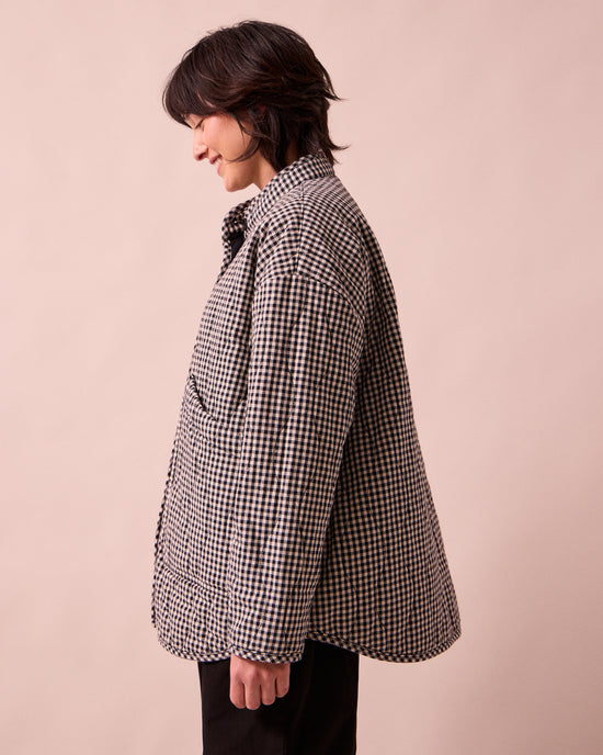 model wears rue black and white mini gingham denim jacket