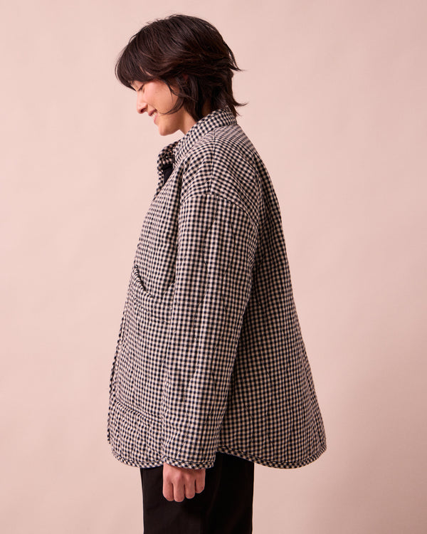 model wears rue black and white mini gingham denim jacket