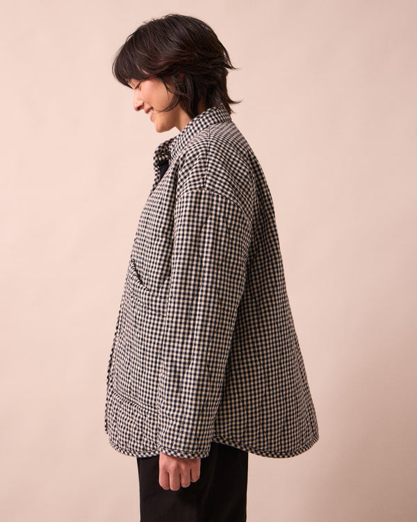 model wears rue black and white mini gingham denim jacket