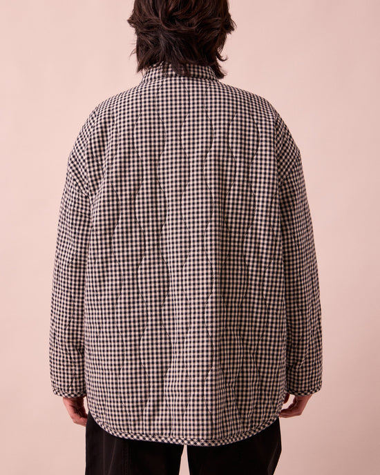 model wears rue black and white mini gingham denim jacket