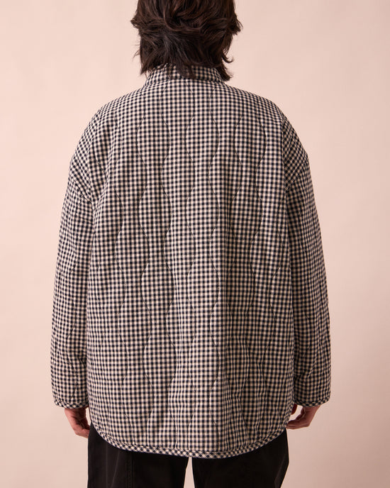 model wears rue black and white mini gingham denim jacket