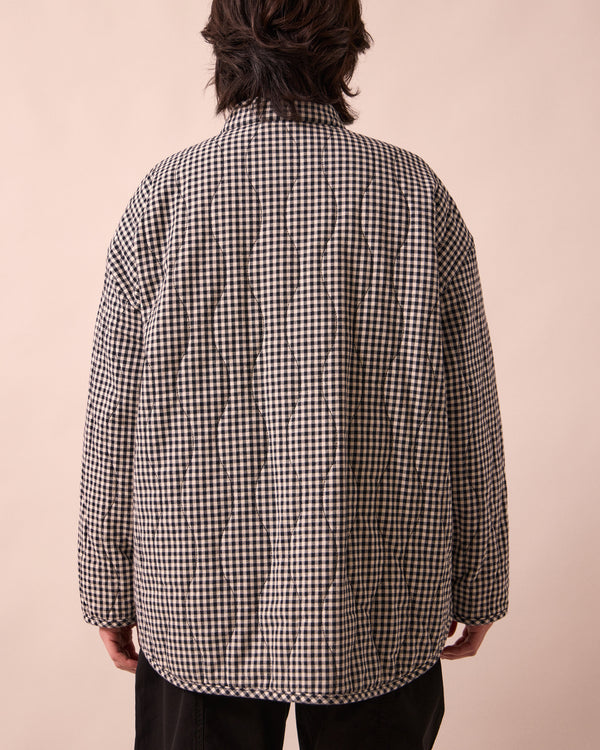 model wears rue black and white mini gingham denim jacket