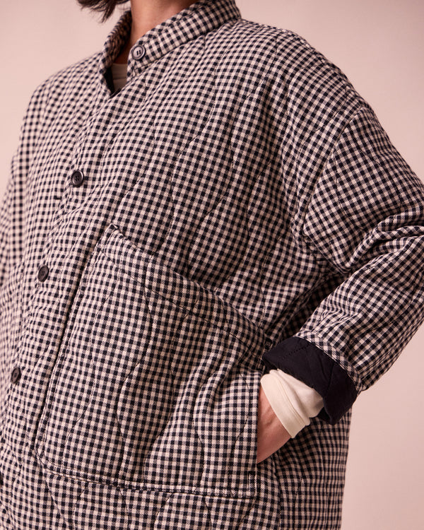 model wears rue black and white mini gingham denim jacket