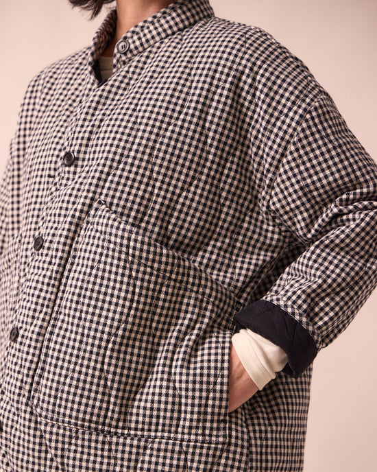 model wears rue black and white mini gingham denim jacket