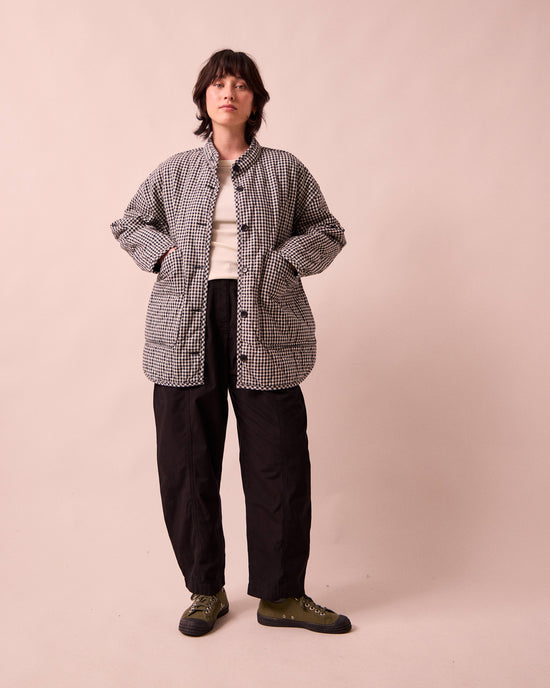 model wears rue black and white mini gingham denim jacket