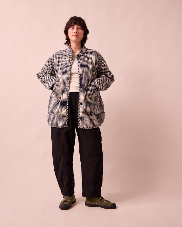 model wears rue black and white mini gingham denim jacket