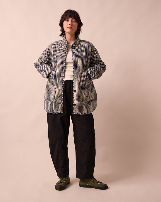 model wears rue black and white mini gingham denim jacket