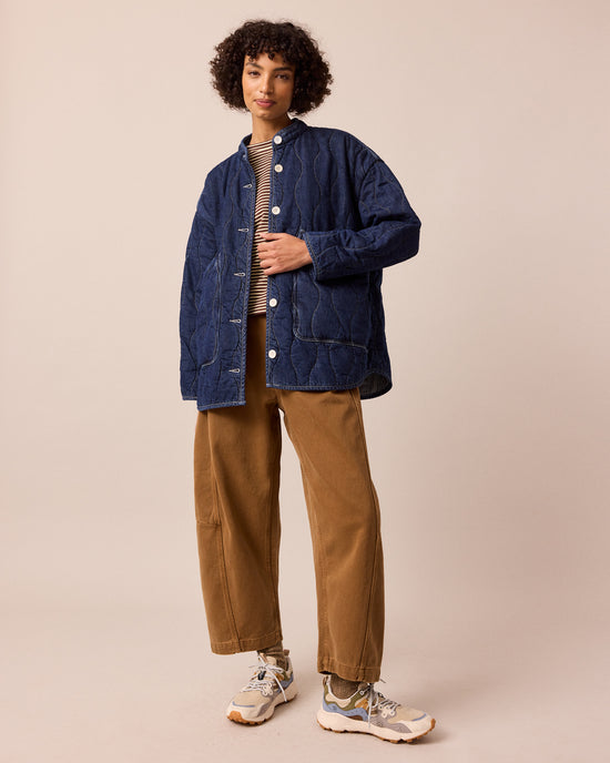 model wears rue mid blue denim quilted jacket