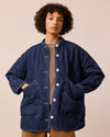 model wears rue mid blue denim quilted jacket