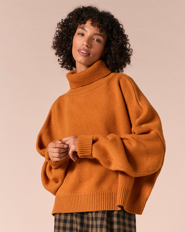 model wears ruth pumpkin spice knitted jumper
