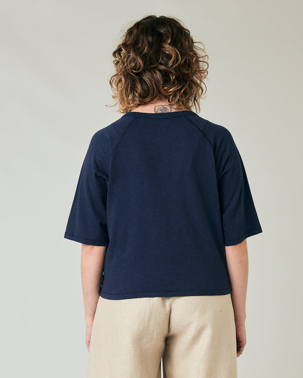 pregnant model wears navy jersey raglan top