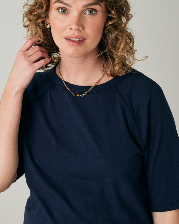 pregnant model wears navy jersey raglan top