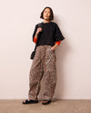 model wears reba leopard print denim jeans