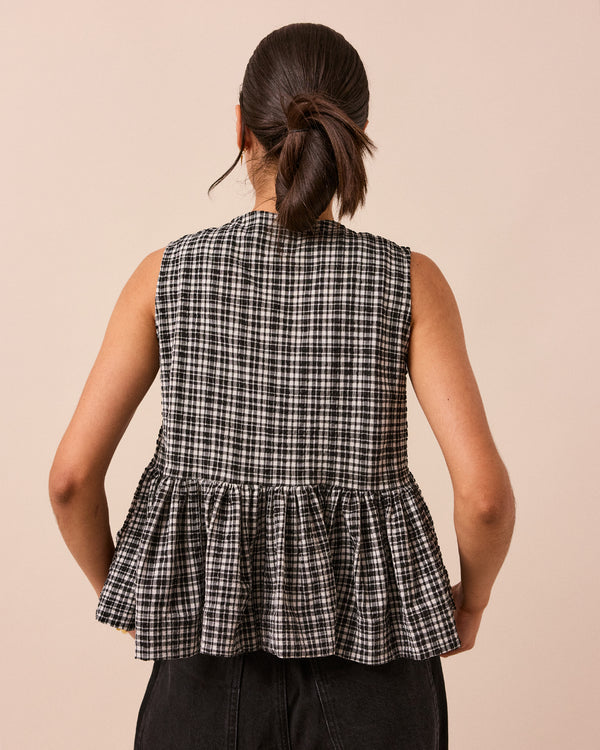 model wears black and white gingham anais seersucker top