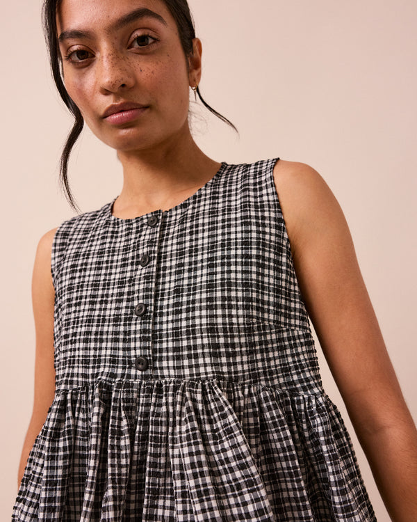 model wears black and white gingham anais seersucker top