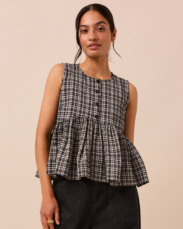 model wears black and white gingham anais seersucker top