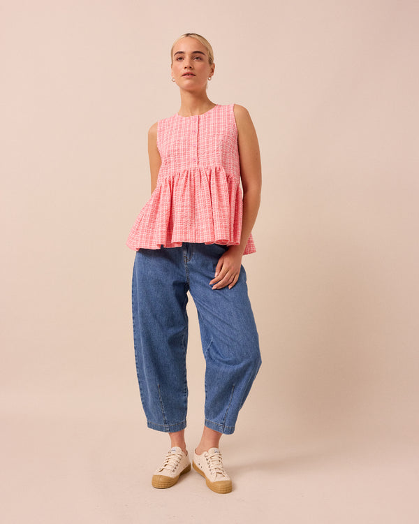 model wears pink gingham anais seersucker top