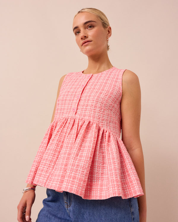 model wears pink gingham anais seersucker top