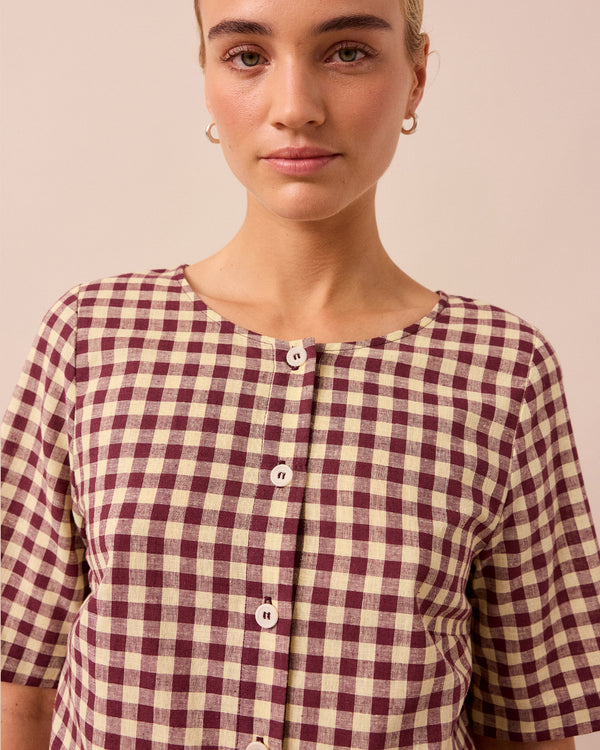 model wears evelyn butter and burgundy cotton linen top