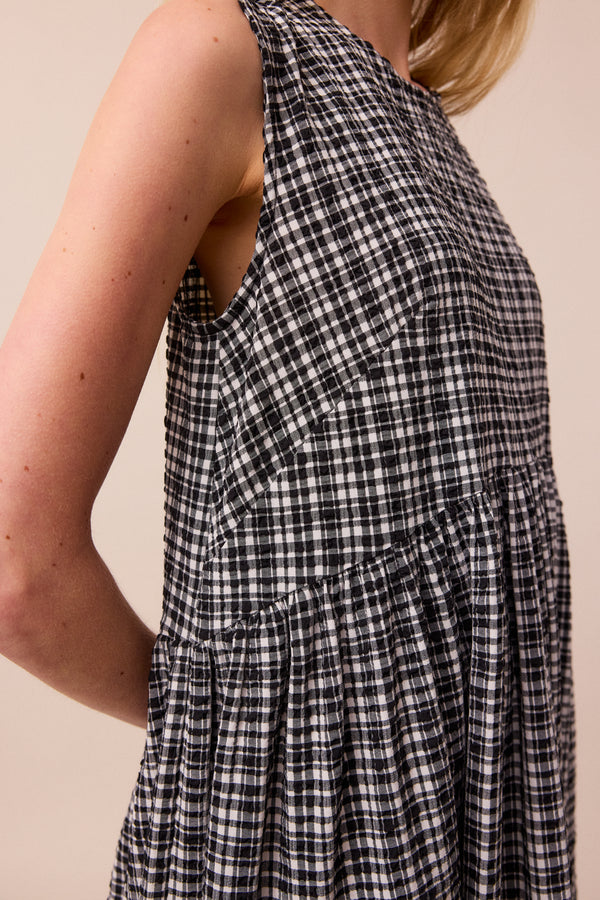 model wears black and white gingham darcy dress