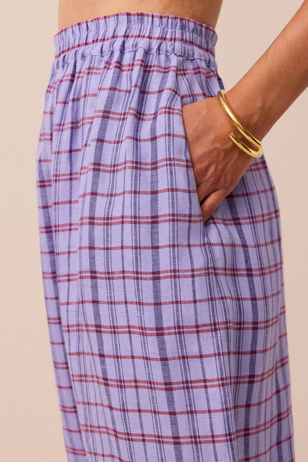 model wears parma violet mabel linen trousers