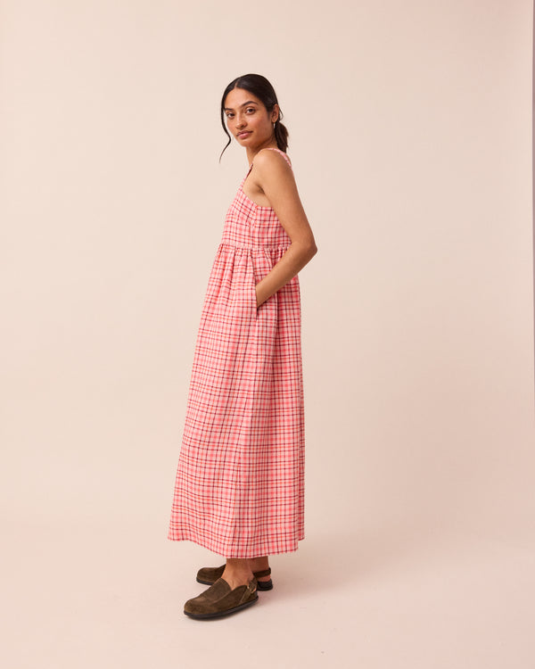 model wears rosewood plaid linen suki dress