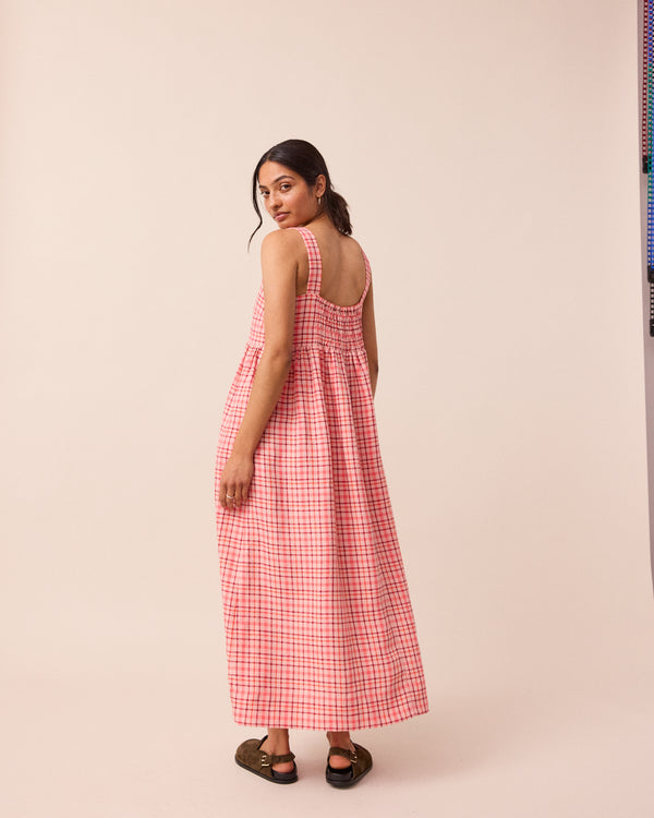 model wears rosewood plaid linen suki dress