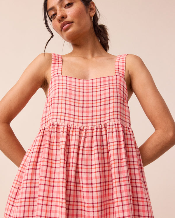 model wears rosewood plaid linen suki dress