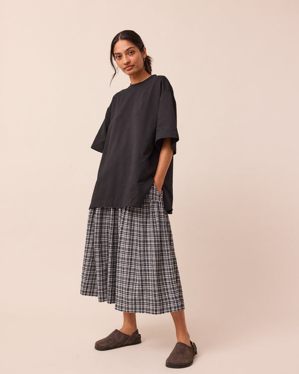 model wears talia seersucker black and white gingham skirt