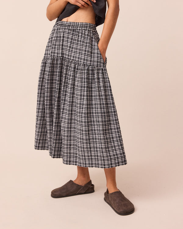 model wears talia seersucker black and white gingham skirt