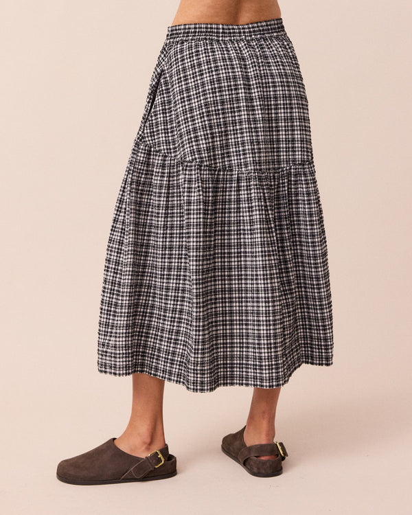 model wears talia seersucker black and white gingham skirt