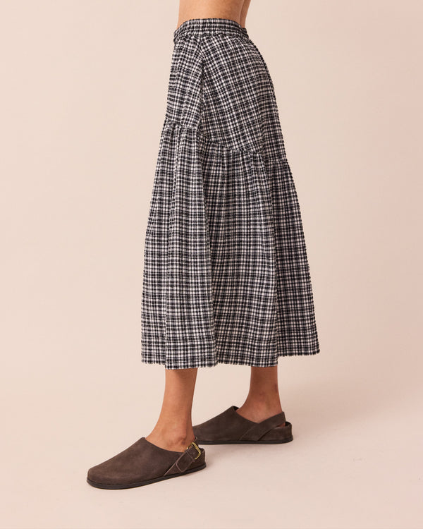 model wears talia seersucker black and white gingham skirt