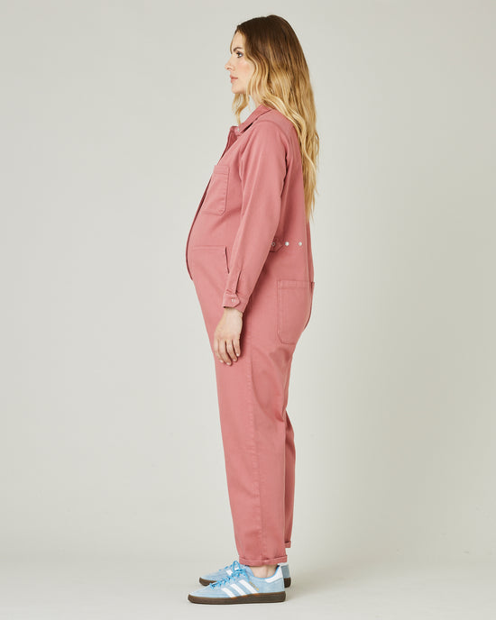 pregnant model wears rose denim coverall