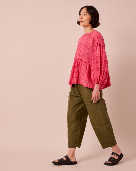 model wears hilda khaki cotton linen trousers right