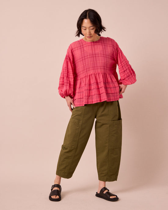model wears hilda khaki cotton linen trousers left