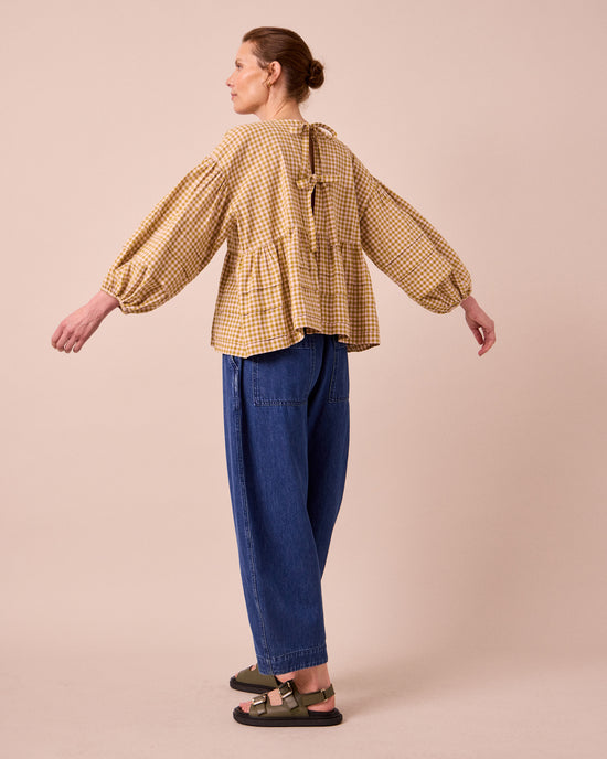 model wears simone garden gingham cotton linen top