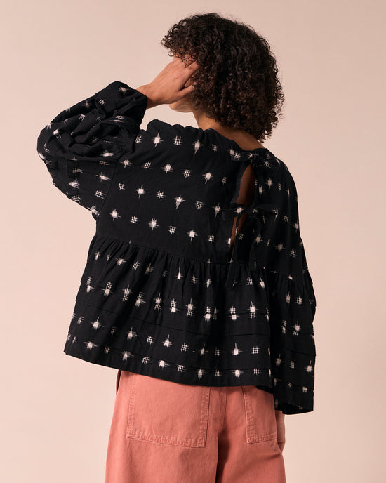 model wears simone ikat cotton top