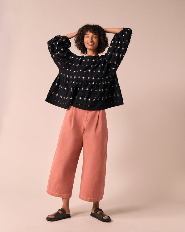 model wears bonnie clay pink denim jeans left