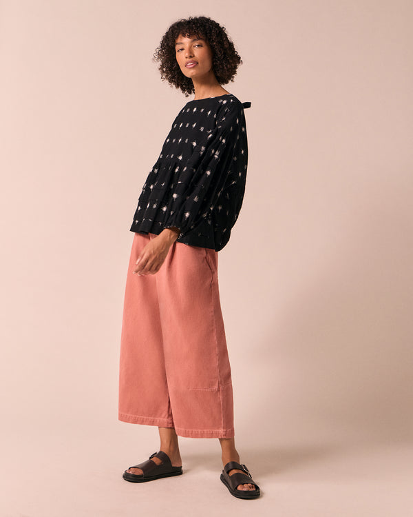 model wears bonnie clay pink denim jeans right