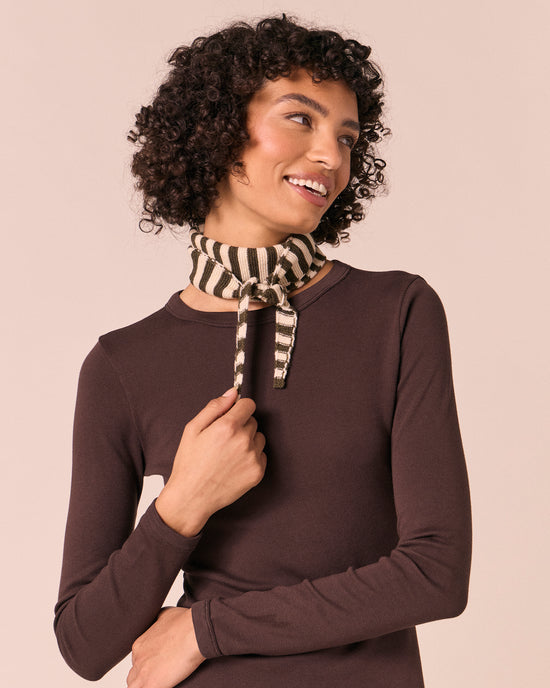 model wears olive and bone knitted skinny neckerchief