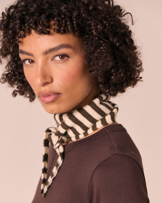 model wears olive and bone knitted skinny neckerchief