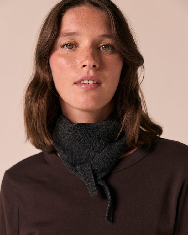 model wears skinned knitted charcoal neckerchief