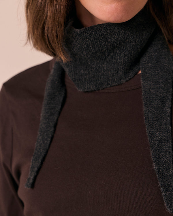 model wears skinned knitted charcoal neckerchief