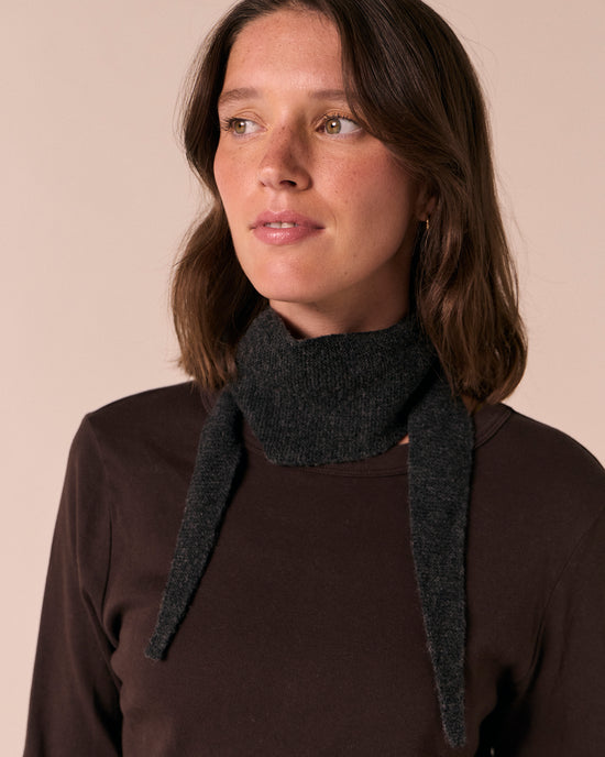 model wears skinned knitted charcoal neckerchief